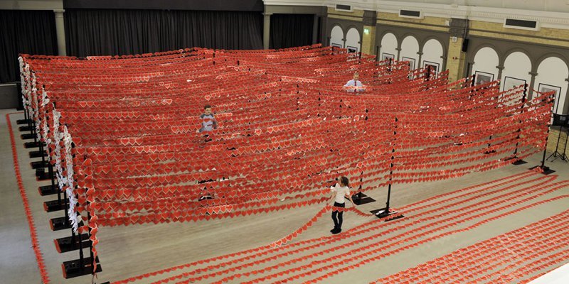 Gabriela Atkins, 10 from Exeter, and Calum Morris, 12 from Bristol, who both born with heart conditions help Simon Gillespie CEO of the British Heart Foundation (BHF) break The Guinness World Records Title for the world’s longest chain of paper hearts. The charity created a chain of 17,939 hearts by joining the messages of BHF supporters, surpassing the current world record of 11,288 by more than 6,500. The chain measured almost one and a half miles and was created as a mark of solidarity for the 7 million people fighting heart and circulatory disease in the UK on a daily basis, and to raise funds for the BHF’s life saving research. For more information – call 02075540555 or email newsdesk@bhf.org.uk